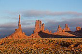 The Totem Pole and the Yei Bi Chei at sunset in the Monument Valley Navajo Tribal Park in Arizona.