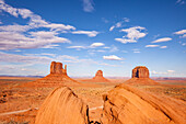 The boulders and the Mittens and Merrick Butte in the Monument Valley Navajo Tribal Park in Arizona.