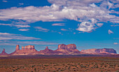 View of the Utah monuments from the northeast in the Monument Valley Navajo Tribal Park in Arizona & Utah. L-R: Big Indian Chief, Castle Butte, the Bear and the Rabbit, the Stagecoach, King on the Throne, Brigham's Tomb and Eagle Mesa.