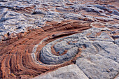 Red swirl in eroded Navajo sandstone. White Pocket Recreation Area, Vermilion Cliffs National Monument, Arizona.
