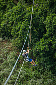 A man ziplining over the rainforest near Sosua in the Dominican Republic.