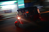 Moving tuk tuk at night, Sri Lanka