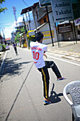 Young boys playing cricket in the street, Galle, Sri Lanka