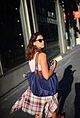 Attractive young woman walking the streets of San Francisco, California.