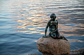 The Little Mermaid Statue at day time in Copenhagen Denmark