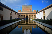 Court of the Myrtles (Patio de los Arrayanes) inside the Nasrid Palaces at The Alhambra, palace and fortress complex located in Granada, Andalusia, Spain