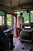 Bus conductor in Nuwara Eliya, Sri Lanka