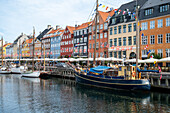 Colorfull facade and old ships along the Nyhavn Canal in Copenhagen Denmark