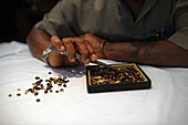 Jeweler shows gems in jewellery shop, Galle, Sri Lanka
