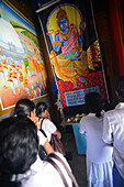 Group of people praying inside Abhayagiri Monastery in Anuradhapura, Sri Lanka