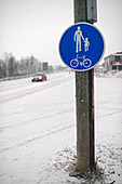Traffic sign and car in winter, Inari, Lapland