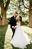 Bride and groom in park