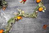 Christmas decoration made from oranges, leaves and pine cones