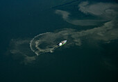 Fishing boat leaving trail at sea