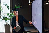 Italy, Businesswoman having presentation in creative studio