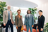 Italy, Portrait of smiling business people standing in creative studio