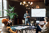 Italy, Businessman having presentation in creative studio