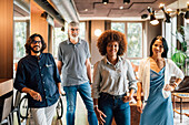 Italy, Portrait of smiling business people in creative studio