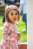 UK, Portrait of girl (2-3) with ice cream cone