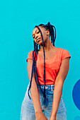 Italy, Milan, Portrait of young woman with braids