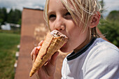 Canada, Ontario, Kingston, Boy (8-9) eating ice cream