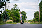 Canada, Ontario, Kingston, Boy (8-9) skateboarding