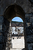 Italy, Sicily, Stone arch in old town