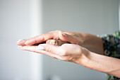 Woman holding soap, close up of hands