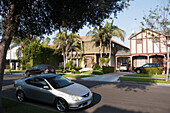 Residential Street With Homes And Parked Cars; California, United States Of America