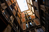 Low Angle View Of A Residential Building With Balconies; Barcelona, Spain