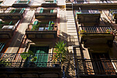 Low Angle View Of Shutter Doors On Balconies; Barcelona, Spain