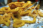 Close Up Of A Fried Dish And Tongs; Barcelona, Spain