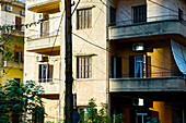 Residential Building With Electrical Wires Strung From A Pole; Beirut, Lebanon
