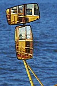 Reflection In The Mirror Of The Side Of A Boat In The Water; Hamburg, Germany