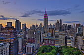 Empire State Building At Sunset With Colours Honoring The Military Order Of The Purple Heart; New York City, New York, United States Of America