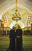 Tourist Couple Inside Sultan Omar Ali Saifuddien Mosque; Bandar Seri Begawan, Brunei