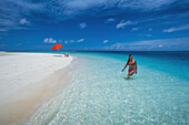 A Woman Wading In The Pristine Waters; Marshall Islands