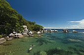 Woman Swimming In Clear Waters Surrounding Mumbo Island, Lake Malawi; Malawi