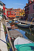 A View Of One Of The Many Of Narrow Canals On Burano Island, The Famous Lace-Making District; Venice, Italy