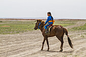 Girl Riding A Horse At The Naadam Festival In Mandal Ovoo, Ã–mnÃ¶govi Province, Mongolia