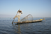 Friendly, Smiling Traditional Leg Paddling Fisherman On Inle Lake; Myanmar