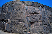 Pre-Columbian reliefs in stone at the Sechin ruins near Casma dating 1600 B.C. They are well-preserved among the Peru's coastal ruins. Three outside walls of the main temple are covered with relief carvings of warriors and of captives being eviscerated.  The gruesomely realistic stone carvings are up to four meters high.  Little is known about the warlike people who are responsible which is one of the site's main points of interest; Casma, Peru