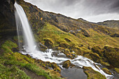 Cascading Hafrafell waterfall in mountains near Stykkisholmur, Snaefellsnes peninsula, western Iceland; Iceland