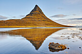 Kirkjufell mountain and it's mirror image in water, near Grundarfjordur, Snaefellsnes, Iceland; Iceland