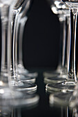 Extreme close up of empty wine glasses lined up
