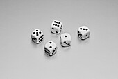 Still life five white and black dice on white background