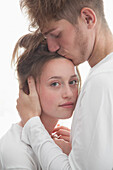 Man Kissing Woman on Forehead