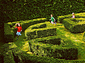 Children Running in Garden Maze