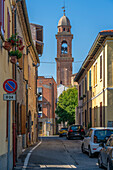 View of church bell tower and narrow street in Rimini, Rimini, Emilia-Romagna, Italy, Europe