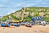 Fishing boats on The Stade (the fishermen's beach) with East Hill Cliff Railway behind, Hastings, East Sussex, England, United Kingdom, Europe